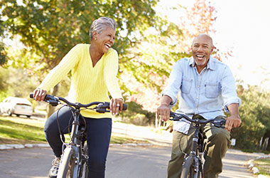 Older couple riding bicycles