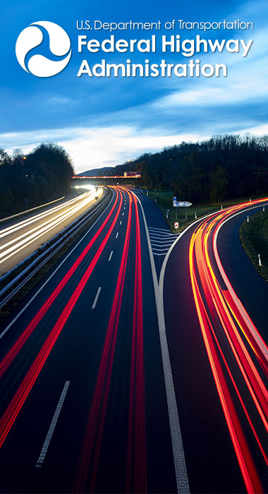 Photo of an interstate at night with the FHWA logo